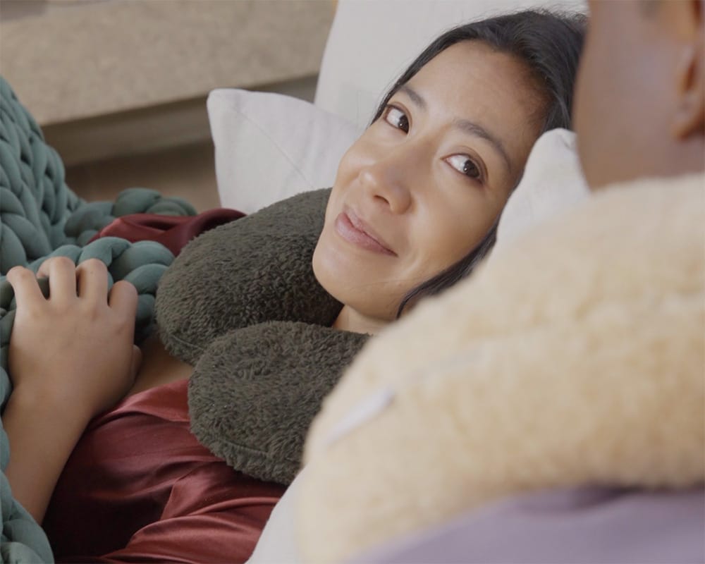 couple wearing neck pillows
