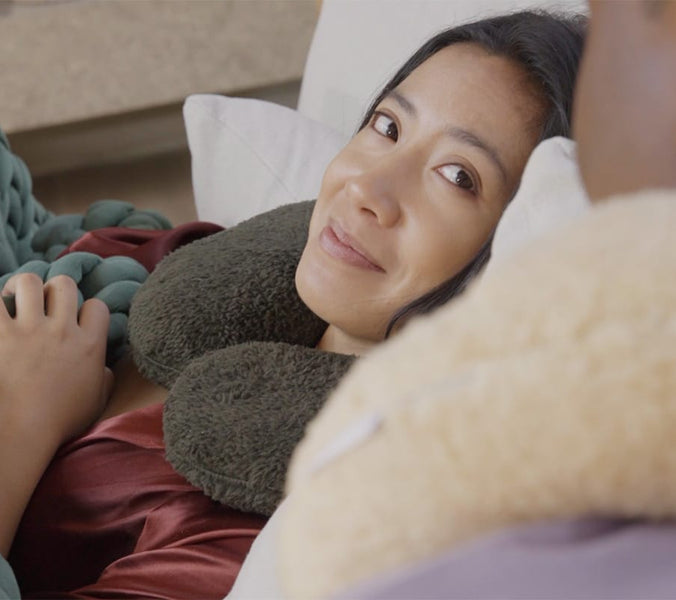 couple wearing neck pillows