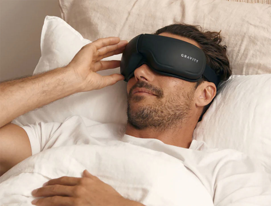 resting man wearing gravity eye massager