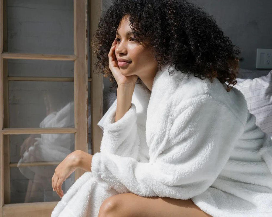 woman wearing soft white robe