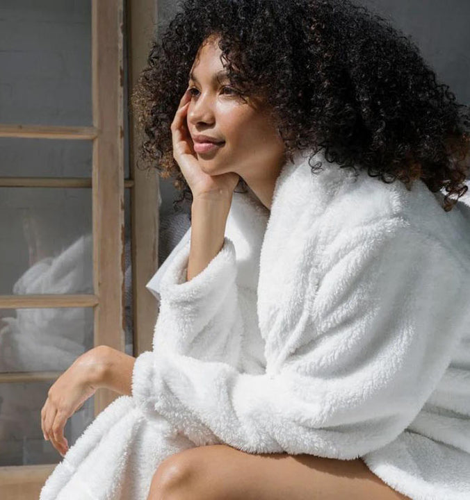 woman wearing soft white robe