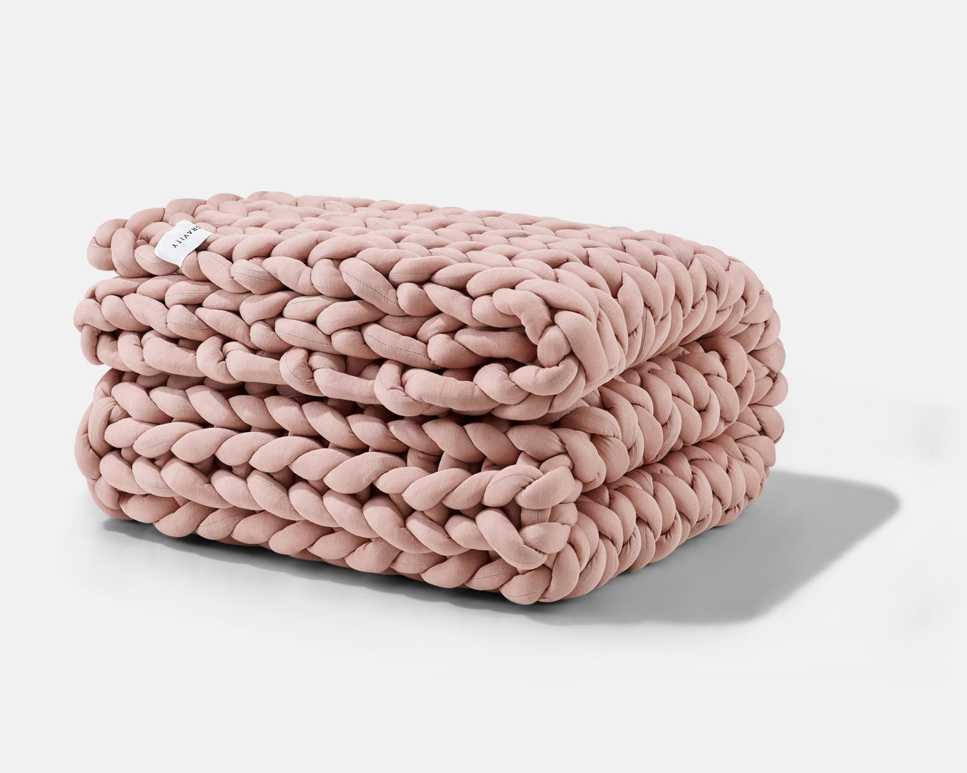 A folded Clay Gravity Weighted Chunky Knit Blanket - #color_clay