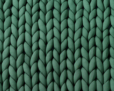 Closeup on the texture of the Deep Forest Gravity Weighted Chunky Knit Blanket - #color_deep-forest