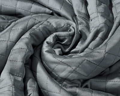 A twisted Classic Grey Gravity Weighted Cooling Blanket - #color_classic-grey