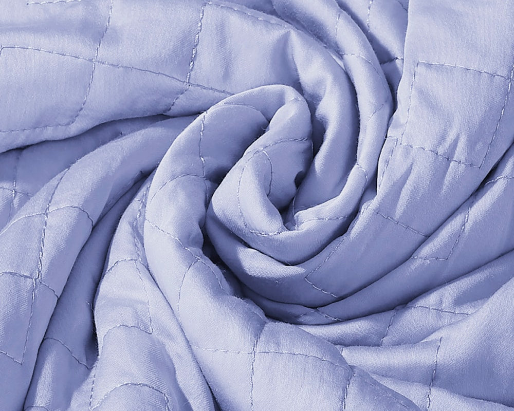 A twisted Periwinkle Gravity Weighted Cooling Blanket - #color_periwinkle