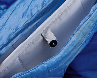 Closeup on the Cerulean Blue Gravity Cooling Weighted Blanket button fastener - #color_cerulean-blue