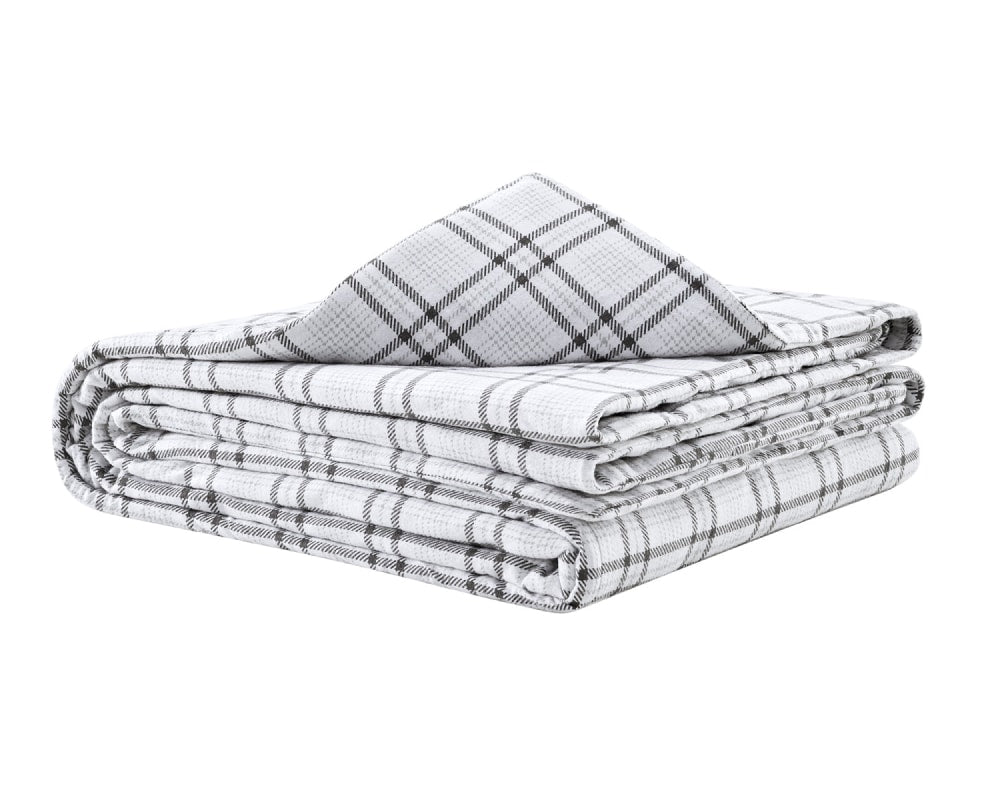 Grey flannel blanket folded against a white backdrop #color_grey-plaid