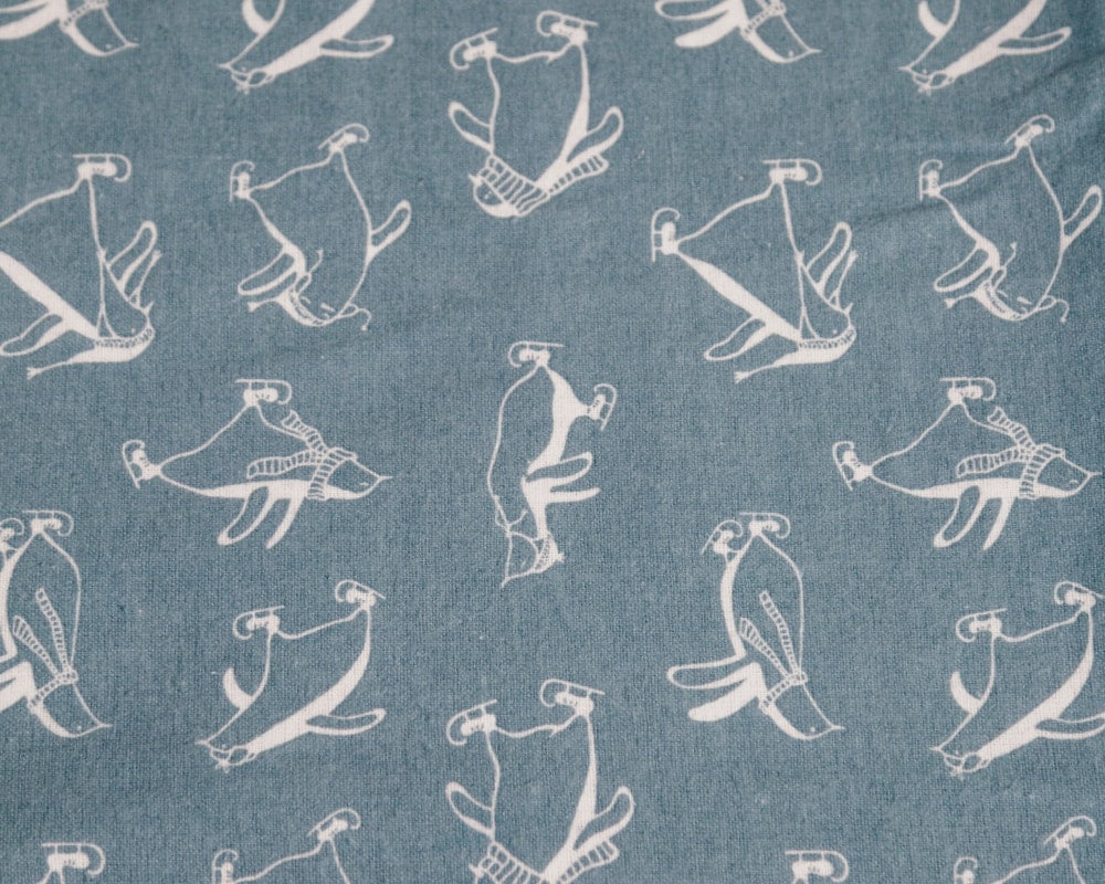 Closeup of sheets with a penguin pattern #color_penguins
