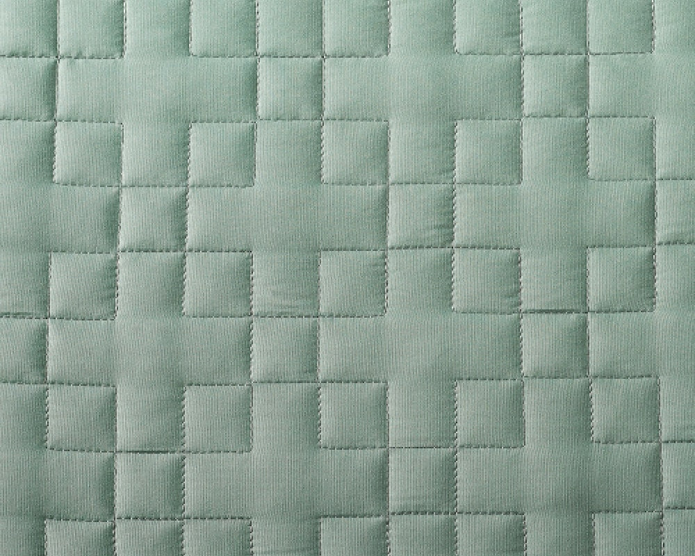 Close-up of plush light green gravity kids weighted blanket