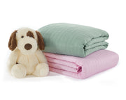 green and pink gravity kids weighted blanket with a plushie