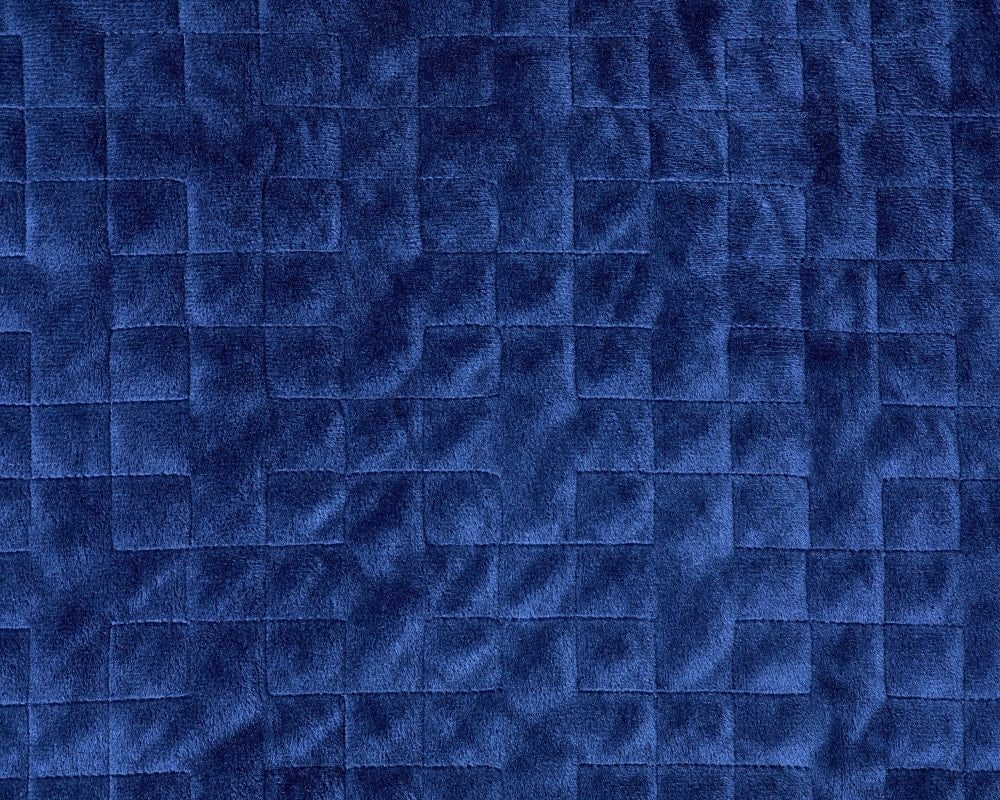 Closeup of stitching on plush navy fabric - #color_navy