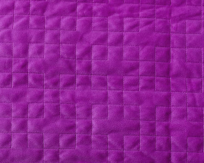 Closeup of stitching on plush plum fabric - #color_plum