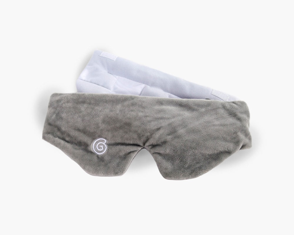 Plush grey weighted sleep mask against a white backdrop