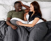 Couple laying under Grey Queen/King gravity Cooling Blanket